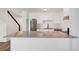 Contemporary kitchen boasting granite countertops and stainless steel appliances with a breakfast bar at 225 E 8Th Ave # A2, Longmont, CO 80504