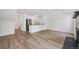 Spacious living area with wood floors, eat-in kitchen, and a cozy fireplace feature at 225 E 8Th Ave # A2, Longmont, CO 80504