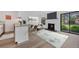Stylish living area featuring a fireplace, TV, open to eat-in kitchen area and sliding glass doors at 225 E 8Th Ave # A2, Longmont, CO 80504