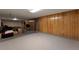 Spacious unfinished basement features paneled walls, storage, and versatile layout at 2520 Dover Ct, Lakewood, CO 80215