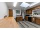 Functional kitchen with wood cabinets, modern appliances, ample counter space and lots of light at 2520 Dover Ct, Lakewood, CO 80215
