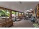 Bright sunroom with large windows, a backyard view, and versatile space at 2520 Dover Ct, Lakewood, CO 80215