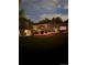 Enjoy this home's backyard with a fire pit, deck, and ample green space, perfect for relaxation and outdoor gatherings at 8700 S Ammons St, Littleton, CO 80128