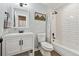 Stylish bathroom featuring a white vanity, subway tile shower, and modern black fixtures at 8700 S Ammons St, Littleton, CO 80128