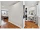 Bright bedroom featuring hardwood floors, makeup vanity and a peek into the main bedroom at 8700 S Ammons St, Littleton, CO 80128