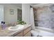 Well-lit bathroom featuring a shower over tub and single sink vanity at 16722 Chilton Dr, Mead, CO 80542