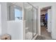 Modern bathroom features a glass-enclosed shower with tile surround and a walk-in closet at 16722 Chilton Dr, Mead, CO 80542