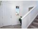 Bright entryway with light hardwood floors, white walls, a staircase, and a window allowing natural light at 16722 Chilton Dr, Mead, CO 80542