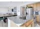 Open concept kitchen and dining area featuring stainless steel appliances at 16722 Chilton Dr, Mead, CO 80542