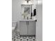 Modern bathroom with gray tile shower and patterned floor at 4389 Zenobia St, Denver, CO 80212