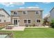 Home's backyard has patio and lawn with home in the background at 10115 Cook St, Thornton, CO 80229