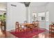 Bright and airy dining room features hardwood floors, open layout, and ample natural light at 10115 Cook St, Thornton, CO 80229
