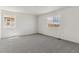 Spacious bedroom with neutral carpet and a bright window offering natural light at 455 S Salida St, Aurora, CO 80017
