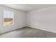 Bright bedroom with neutral gray carpet and a window offering natural light at 455 S Salida St, Aurora, CO 80017