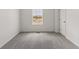 Bright bedroom with neutral carpet and a window and a door at 455 S Salida St, Aurora, CO 80017