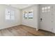 Bright entryway with white walls, luxury vinyl plank flooring and plenty of natural light at 455 S Salida St, Aurora, CO 80017