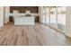 Open concept living room flows into the kitchen and features luxury vinyl plank flooring at 455 S Salida St, Aurora, CO 80017