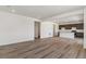 Spacious living area opening to the kitchen, featuring modern flooring and neutral color palette at 455 S Salida St, Aurora, CO 80017