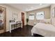 Cozy bedroom with hardwood floors and natural light at 7642 S Ames Way, Littleton, CO 80128