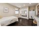 Bedroom featuring a work desk and wardrobe mirror closet at 7642 S Ames Way, Littleton, CO 80128