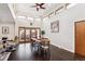 Dining area featuring hardwood floors, views of the backyard, and vaulted ceilings at 7642 S Ames Way, Littleton, CO 80128