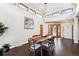 Dining area with hardwood floors, clerestory windows and modern table at 7642 S Ames Way, Littleton, CO 80128