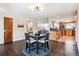 Open concept dining room area looking into the kitchen and living room at 7642 S Ames Way, Littleton, CO 80128