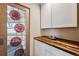 Hallway featuring a stained glass door and butcher block countertop at 7642 S Ames Way, Littleton, CO 80128