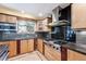 Spacious kitchen featuring stainless steel appliances and hardwood floors at 7642 S Ames Way, Littleton, CO 80128