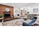 Inviting living room with a brick fireplace and comfortable seating at 7642 S Ames Way, Littleton, CO 80128