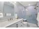 Modern bathroom featuring a spacious shower, vanity with a large mirror and clean fixtures at 480 S Marion Pkwy # 306, Denver, CO 80209