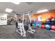 Well-equipped fitness center featuring modern machines, weights, and colorful decor for an active lifestyle at 480 S Marion Pkwy # 306, Denver, CO 80209