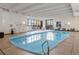 Bright indoor pool with lounge chairs, providing a relaxing and convenient recreation area year-round at 480 S Marion Pkwy # 306, Denver, CO 80209