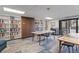 A cozy library with floor to ceiling shelves filled with books and a door to the outside at 480 S Marion Pkwy # 306, Denver, CO 80209