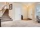 A welcoming entryway with a staircase and a neutral color scheme at 19131 E Crestridge Cir, Aurora, CO 80015