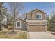 Charming two-story home with a well-maintained lawn and beautiful landscaping at 19131 E Crestridge Cir, Aurora, CO 80015