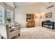 Bright living room featuring vaulted ceilings, neutral colors, and plush carpeting at 19131 E Crestridge Cir, Aurora, CO 80015
