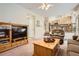 Inviting living room with a ceiling fan, comfortable seating, and natural light at 19131 E Crestridge Cir, Aurora, CO 80015