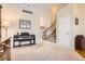 Open-concept living space with stairway and natural light at 19131 E Crestridge Cir, Aurora, CO 80015