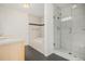 Modern bathroom featuring a soaking tub and glass-enclosed shower at 2935 S Sherman St, Englewood, CO 80113