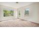 Bright bedroom featuring lots of natural light from two large windows, and neutral carpeting at 2935 S Sherman St, Englewood, CO 80113