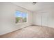 Bright bedroom with a large window and a spacious closet with sliding doors at 2935 S Sherman St, Englewood, CO 80113