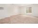 Spacious carpeted room with natural light and window well at 2935 S Sherman St, Englewood, CO 80113