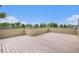 Large rooftop deck with wood flooring and privacy wall at 2935 S Sherman St, Englewood, CO 80113