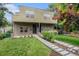 Modern two-story home with a brick facade, landscaped yard, and a unique walkway at 2935 S Sherman St, Englewood, CO 80113
