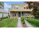 Contemporary home with brick accents, manicured lawn and a modern walkway leading to the entrance at 2935 S Sherman St, Englewood, CO 80113