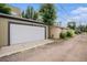 Detached two-car garage with white door at 2935 S Sherman St, Englewood, CO 80113