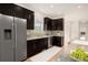 Modern kitchen boasts sleek cabinetry, stainless steel appliances, and granite countertops for a luxurious cooking experience at 2935 S Sherman St, Englewood, CO 80113