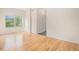 Bright living area with hardwood floors and large windows, offering ample natural light at 2935 S Sherman St, Englewood, CO 80113