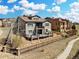 Lovely home featuring a spacious deck, fenced yard, and beautifully landscaped surroundings at 15230 W Baker Ave, Lakewood, CO 80228